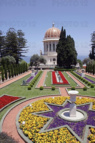 ISRAEL, Northern Coast, Haifa, "Zionism Avenue.  View of Baha'i Shrine and Gardens built as a memorial to the founders of the Baha’i faith.  Formal flower beds, paths and cypress trees with domed shrine."