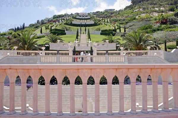 ISRAEL, Northern Coast, Haifa, Zionism Avenue.  View of Baha'i gardens built as memorial to founders of the Baha’i faith.  Colonnaded balcony in foreground with view across tiered gardens stretching out beyond.