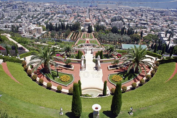 ISRAEL, Northern Coast, Haifa, "Zionism Avenue.  View of Baha'i Shrine and Gardens, tiered formal gardens with pathways, palms and cypress trees with central shrine and city beyond."