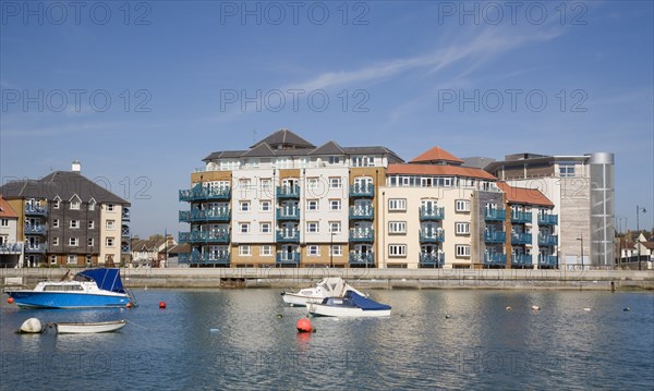 ENGLAND, West Sussex, Shoreham-by-Sea, Ropetackle modern housing development apartments on the banks of the river Adur seen from the opposite bank.. A regenerated brownfield former industrial area.