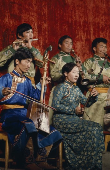 MONGOLIA, Music, "Altai Provincial Orchestra, Altai the provincial capital. Musicians playing various traditional Mongol instruments. East Asia Asian Classic Classical Historical Mongol Uls Older "