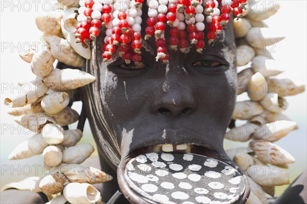 ETHIOPIA, South Omo Valley, Mursi Tribe, Woman with lip plate.