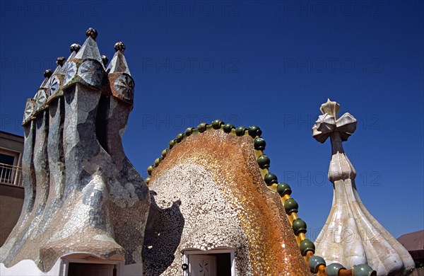 SPAIN, Catalonia, Barcelona, "Passeig de Gracia, Casa Batllo, Ornate chimneys, Dragon's back roof and Saint George cross. Gaudi"