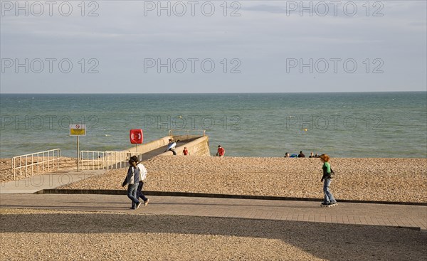 ENGLAND, East Sussex, Brighton, Rollerblading on the seafront promenade.