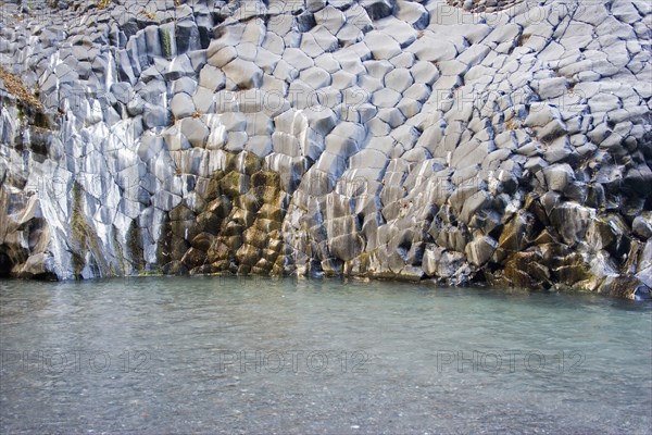 ITALY, Sicily, Alcantara, Alcantara Fluvial Park.  Volcanic rocks in a fish scales formation.