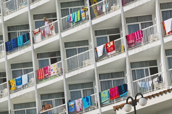 20091064 Hotel balconies with beach towels drying over balustrades. Handrails Railings Beaches Espainia Espana Espanha Espanya European Hispanic Holidaymakers Resort Sand Sandy Seaside Shore Southern Europe Spanish Tourism Tourist Region - Europe Weste