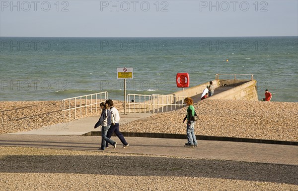 ENGLAND, East Sussex, Brighton, Rollerblading on the seafront promenade.