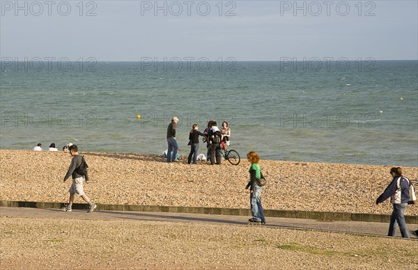 ENGLAND, East Sussex, Brighton, Rollerblading on the seafront promenade.