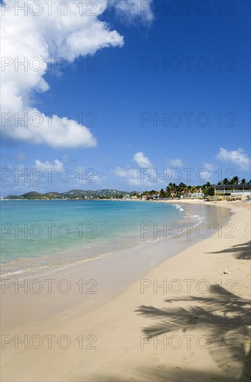 WEST INDIES, St Lucia, Gros Islet, Reduit Beach in Rodney Bay with tourists in the water and on the beach