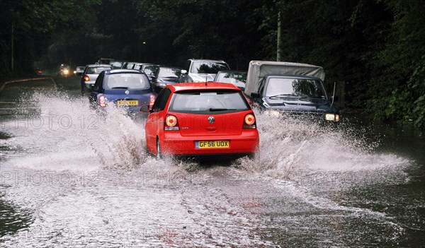 CLIMATE, Weather, Flooding, Cars driving through flash floods in Sevenoaks Kent.