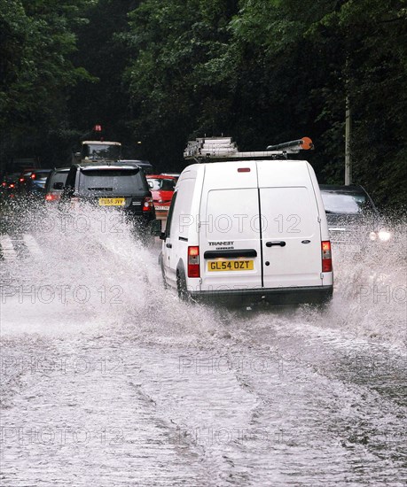 CLIMATE, Weather, Flooding, Cars driving through flash floods in Sevenoaks Kent.