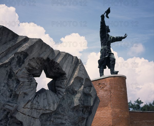 HUNGARY, Near Budapest, Statue Park. Communist statue of Captain Steinmetz and Buda Volunteers Regiment Memorial