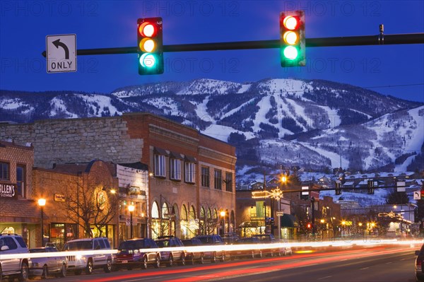 20091045 Busy street scene evening light. American North America United States America Warm Light  Region - North AmericaDominant OrangeDominant BlueUrbanTransportArchitectureTravelTRAVEL Brochure Jon Hicks 20091045 USA Colorado Steamboat Springs