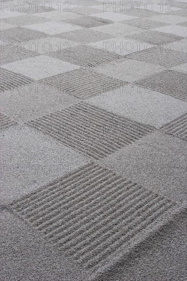 JAPAN, Honshu, Kyoto, "Ryoan-ji, Ukyo-ku.  Zen sand garden made by Zen Buddhist monks at Ryoan - ji temple.  Close cropped detail of chequer-board pattern effect. "