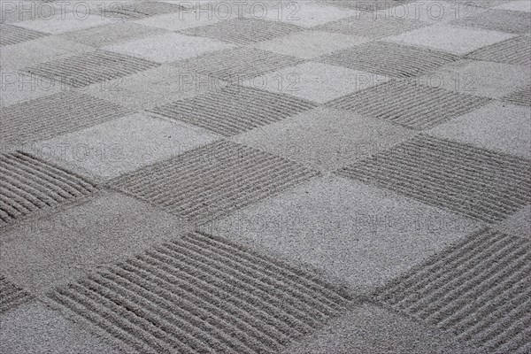 JAPAN, Honshu, Kyoto, "Ryoan-ji, Ukyo-ku.  Zen sand garden made by Zen Buddhist monks at Ryoan - ji temple.  Close cropped detail of chequer-board pattern effect. "