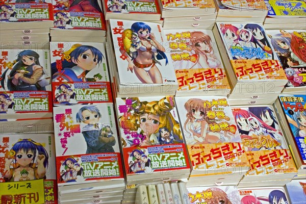JAPAN, Honshu, Tokyo, Akihabara Electronics District.  Japanese Manga books with brightly illustrated covers.