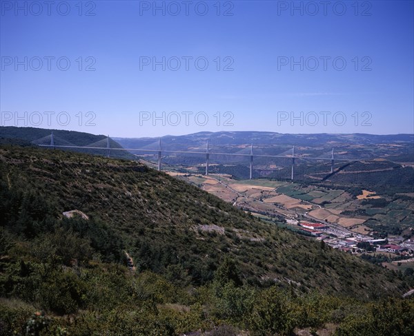 FRANCE, Midi-Pyrenees, Aveyron, Millau.  Millau bridge which spans the Tarn River Valley and carries the A75 motorway from Beziers to Clermont Ferrand.  Seen from the south east.