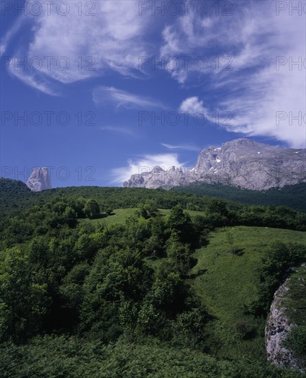 SPAIN, Asturias, Picos de Europa, Urrieles mountain group or Central Massif with Picu Urrielu 2519 m / 8252 ft on left of Neveron de Urrielu 2559 m / 8381 ft seen from east of Bulnes village.