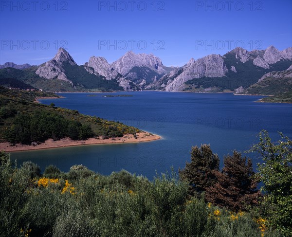 SPAIN, Cordillera Cantabria, Embalse de Riano, Landscape with man-made lake and mountain range beyond with Mt. Gribo on left 1675 m / 5486 ft.