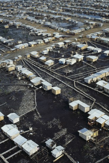 ECUADOR, Guayas Province, Guayaquil , Aerial view over slum housing with stilt buildings built over untreated sewage
