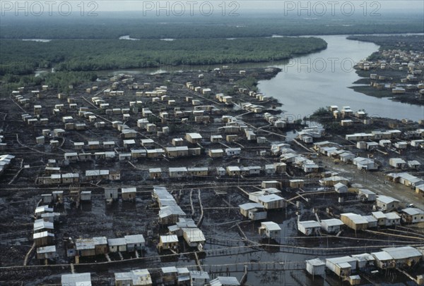 ECUADOR, Guayas Province, Guayaquil , Aerial view over slum housing with stilt buildings built over untreated sewage