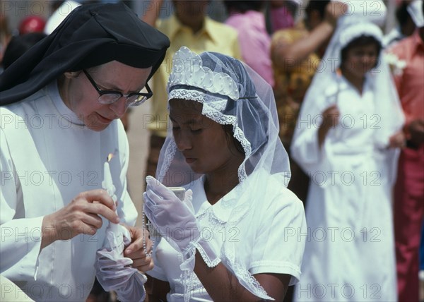 ECUADOR, Guayas Province, Guayaquil , Roman Catholic Confirmation Cermony taking place in Barrio Indio Guayas slum neighbourhood.