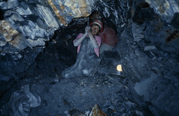 BOLIVIA, Potosi, Tin miner at work in mine