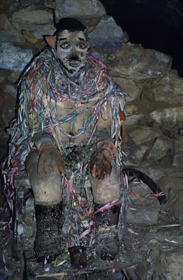 BOLIVIA, Potosi, Llallagua, Siglo XX  Tin Mine. Tio The God Who Protects the Miners. Miners give Tio offerings of coca leaves and cigarettes