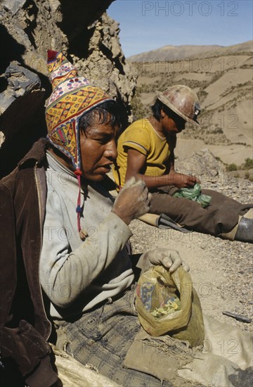 BOLIVIA, Chukiuta, Tin miners eating coca leaves