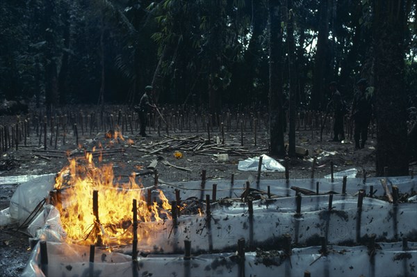 COLOMBIA, , The army burning and destroying a jungle cocaine laboratory in the war against illegal drugs