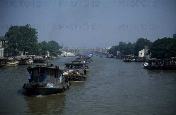 CHINA, Jiangsu Province, Transport, Barge train travelling down the Grand Canal between Suzhou and Wuxi.