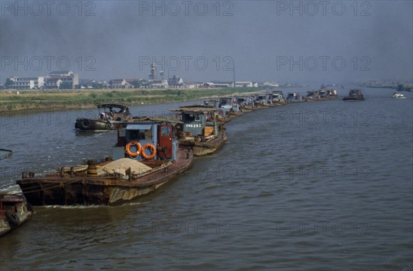 CHINA, Jiangsu Province, Transport, Barge train travelling down the Grand Canal between Suzhou and Wuxi.