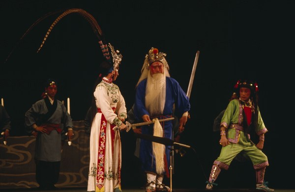 CHINA, Hebei, Beijing, Chinese Opera with male and female performers dressed in costume on stage