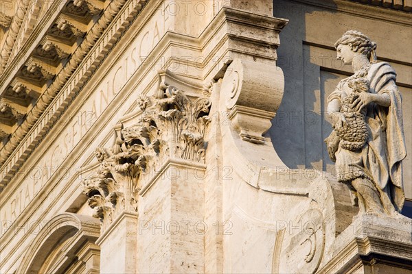 ITALY, Lazio, Rome, Facade of the Church of Santa Francesca Romana the saint who cared for the poor in 15th Century Rome showing intricate carved marble and a statue