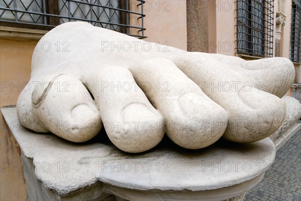 ITALY, Lazio, Rome, Palazzo Dei Conservatore courtyard part of the Capitoline Museums with giant marble feet from various ancient colossus statues