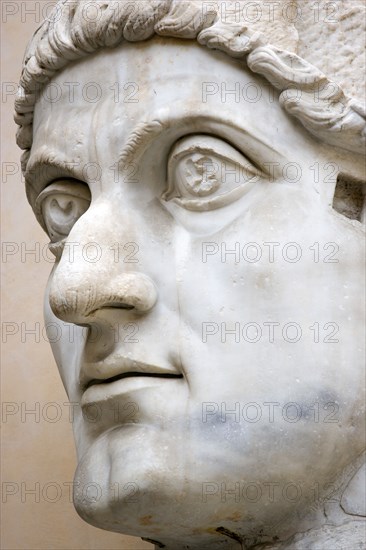 ITALY, Lazio, Rome, Palazzo Dei Conservatore courtyard part of the Capitoline Museums with a giant marble head from an ancient 4th Century colossus statue of Emperor Constantine I