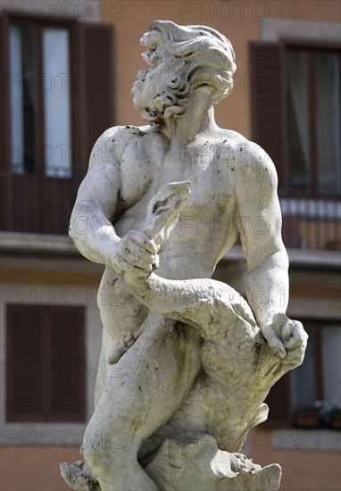 ITALY, Lazio, Rome, The Fontana del Moro or Fountain of the Moor in Piazza Navona. This central figure of a triton riding a dolphin was carved by Bernini in 1654 and resembles a Moor which gives the fountain its name