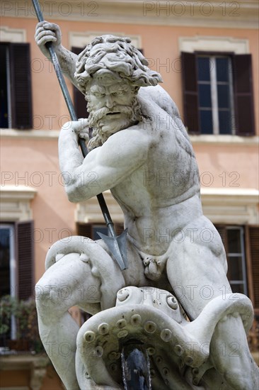 ITALY, Lazio, Rome, Piazza Navona The Fontana di Nettuno or Fountain of Neptune with the central figure of the sea god Neptune fighting an octopus