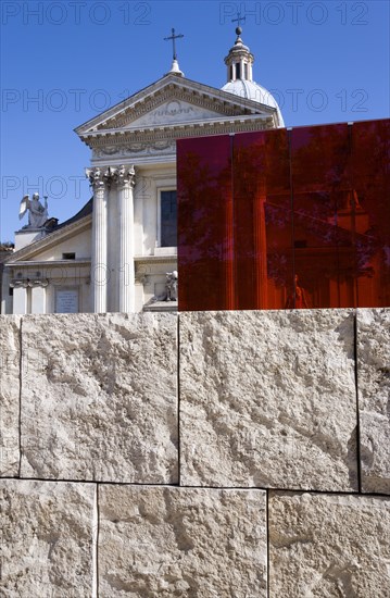ITALY, Lazio, Rome, Neo Classical Church of San Rocco and red perspex cube behind a stone wall at the Ara Pacis