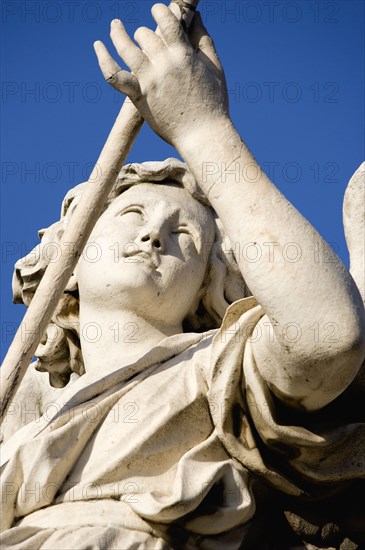 ITALY, Lazio, Rome, Statue of a winged female angel on the Ponte Sant Angelo bridge over the River Tiber