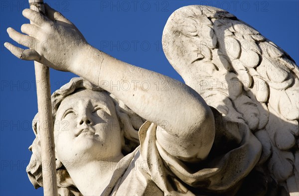 ITALY, Lazio, Rome, Statue of a winged female angel on the Ponte Sant Angelo bridge over the River Tiber