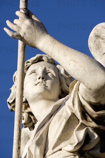 ITALY, Lazio, Rome, Statue of a winged female angel on the Ponte Sant Angelo bridge over the River Tiber