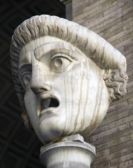 ITALY, Lazio, Rome, Vatican City Museums A carved face with gaping open mouth in the Octagonal Courtyard of the Belvedere Palace