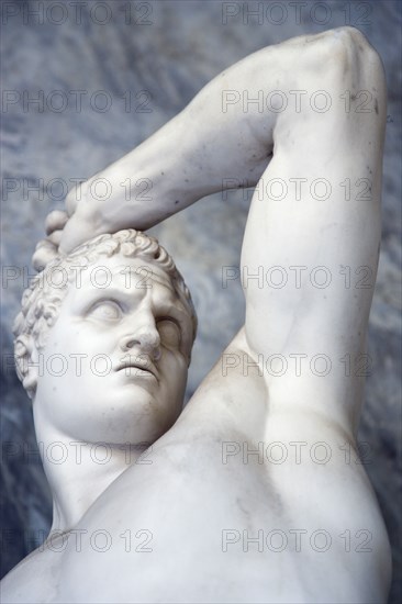 ITALY, Lazio, Rome, Vatican City Museums Statue of a man raising his arm in the Octagonal Courtyard of the Belvedere Palace