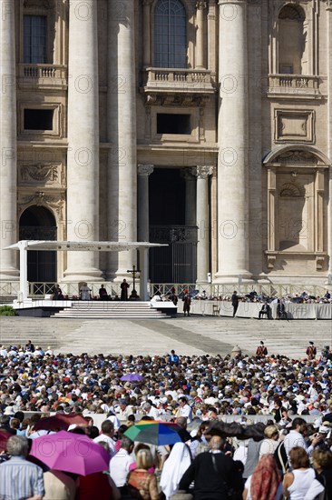 ITALY, Lazio, Rome, Vatican City Pope Benedict XVI under a canopy during an audience in Piazza San Pietro in front of the Basilica of Saint Peter with crowds in the square