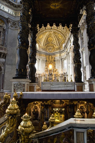 ITALY, Lazio, Rome, Vatican City The Basilica of St Peter The canopied Baldacchino by Bernini with his Throne of Saint Peter in Glory beyond