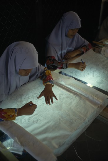 MALAYSIA, Crafts, Young women tracing floral patterns first on to paper then transferring them to silk or satin.