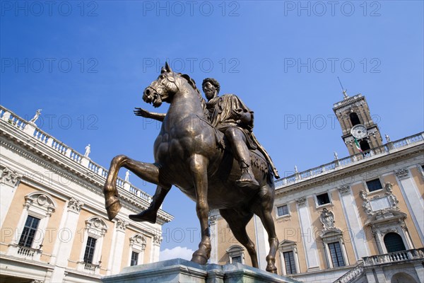 ITALY, Lazio, Rome, Bronze statue of Marcus Aurelius in the Piazza del Campidoglio on the Capitol with Palazzo Nuovo part of the Capitoline Museum on the left and Palazzo Senatorio now the City Hall on the right