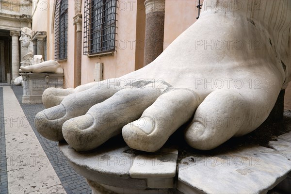 ITALY, Lazio, Rome, The courtyard of the Palazzo dei Conservatori part of the Capitoline Museum with large marble feet from colossal ancient statues