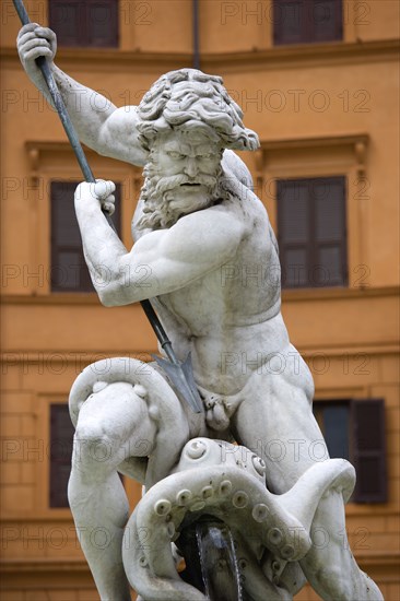 ITALY, Lazio, Rome, The central figure of the sea god Neptune fighting an octopus on the Fontana di Nettuno or Neptune Fountain in the Piazza Navona